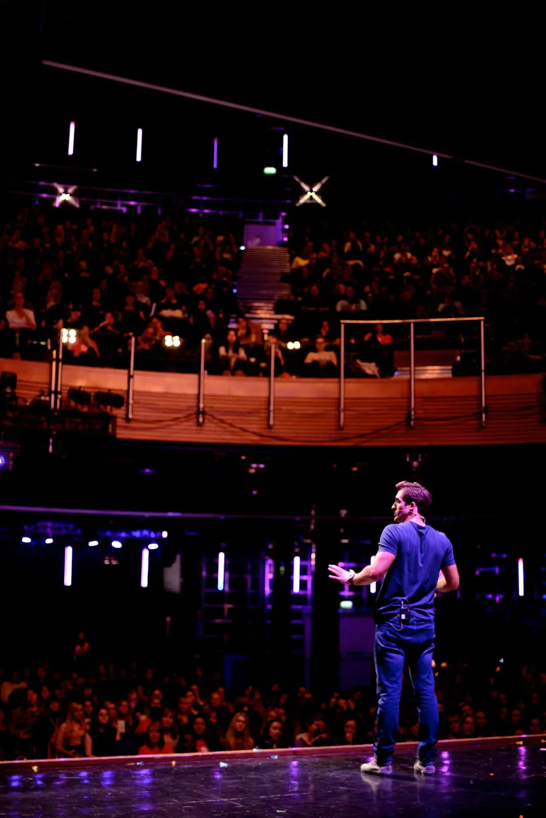 Matthew Hussey on stage speaking to a live audience